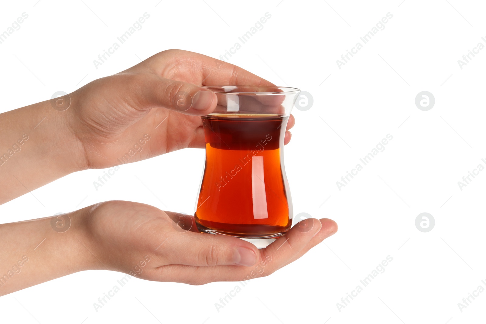 Photo of Woman holding glass of traditional Turkish tea on white background, closeup