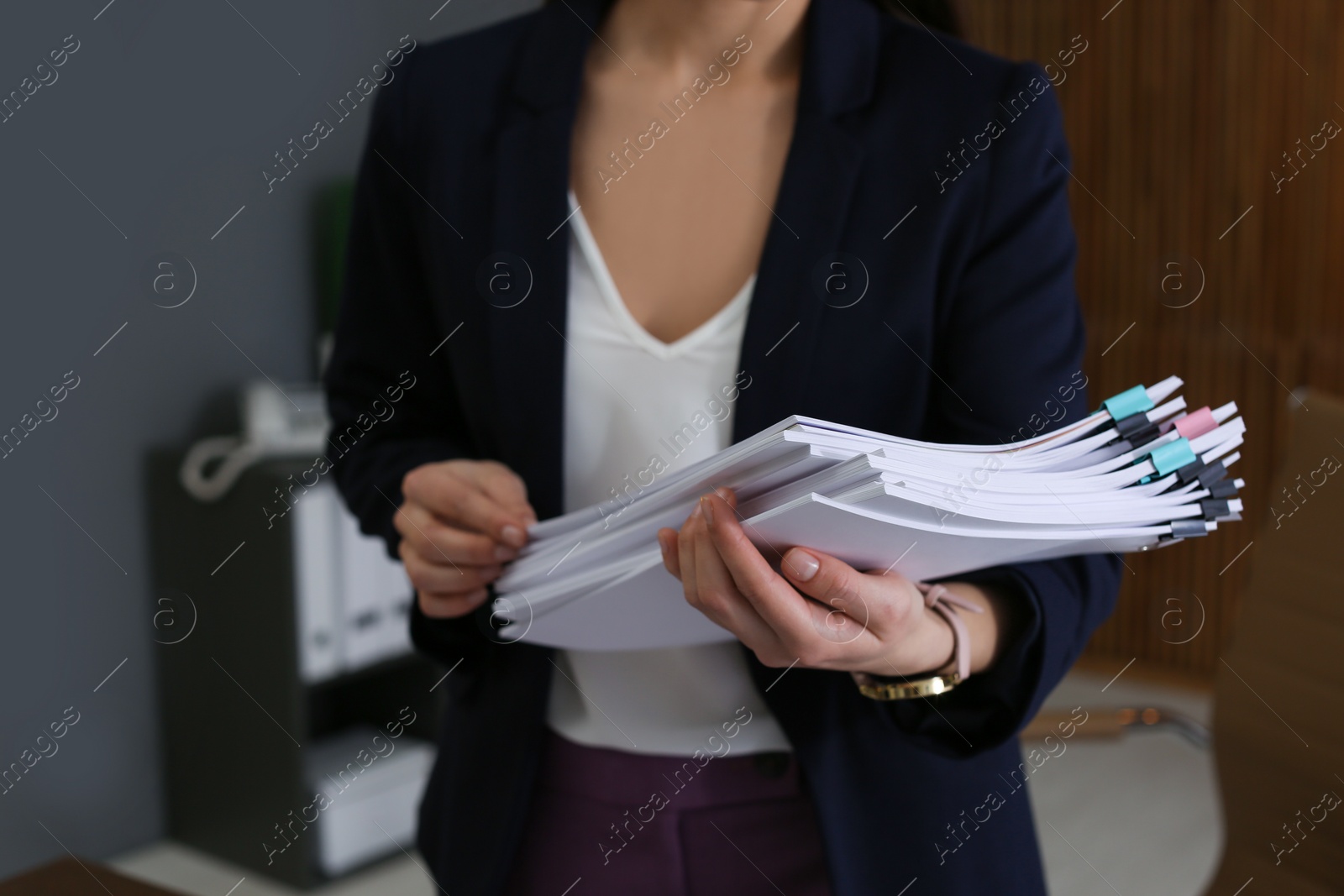 Photo of Businesswoman working with documents in office, closeup