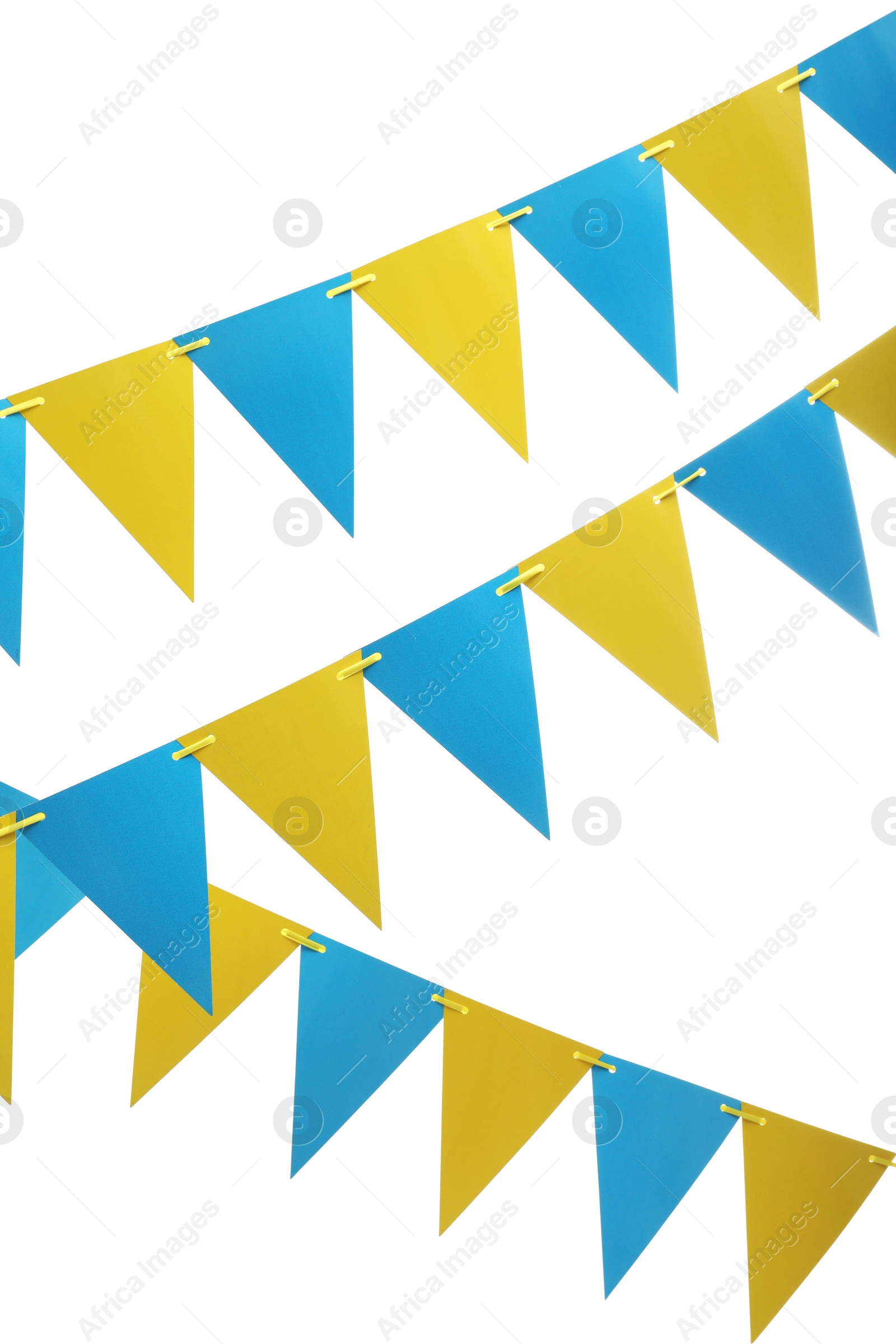 Photo of Rows of triangular bunting flags on white background. Festive decor