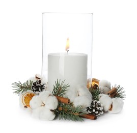 Glass holder with burning candle and Christmas decor isolated on white