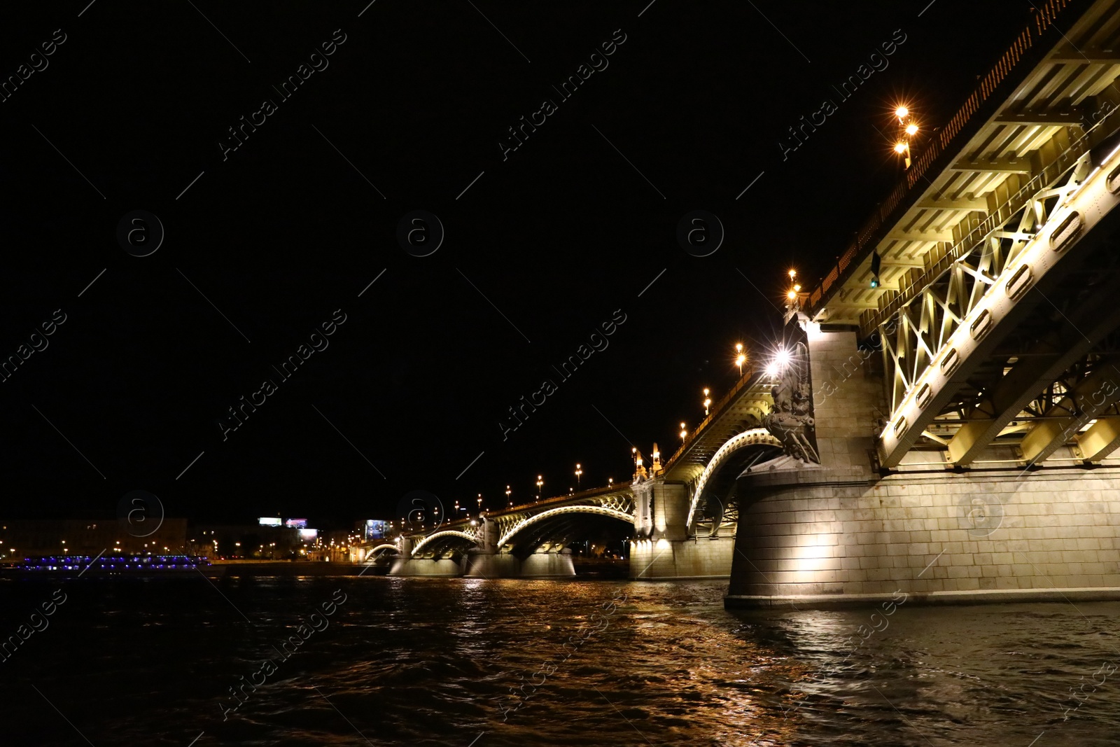 Photo of BUDAPEST, HUNGARY - APRIL 27, 2019: Beautiful night cityscape with illuminated Margaret Bridge across Danube river