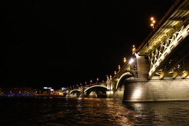 Photo of BUDAPEST, HUNGARY - APRIL 27, 2019: Beautiful night cityscape with illuminated Margaret Bridge across Danube river