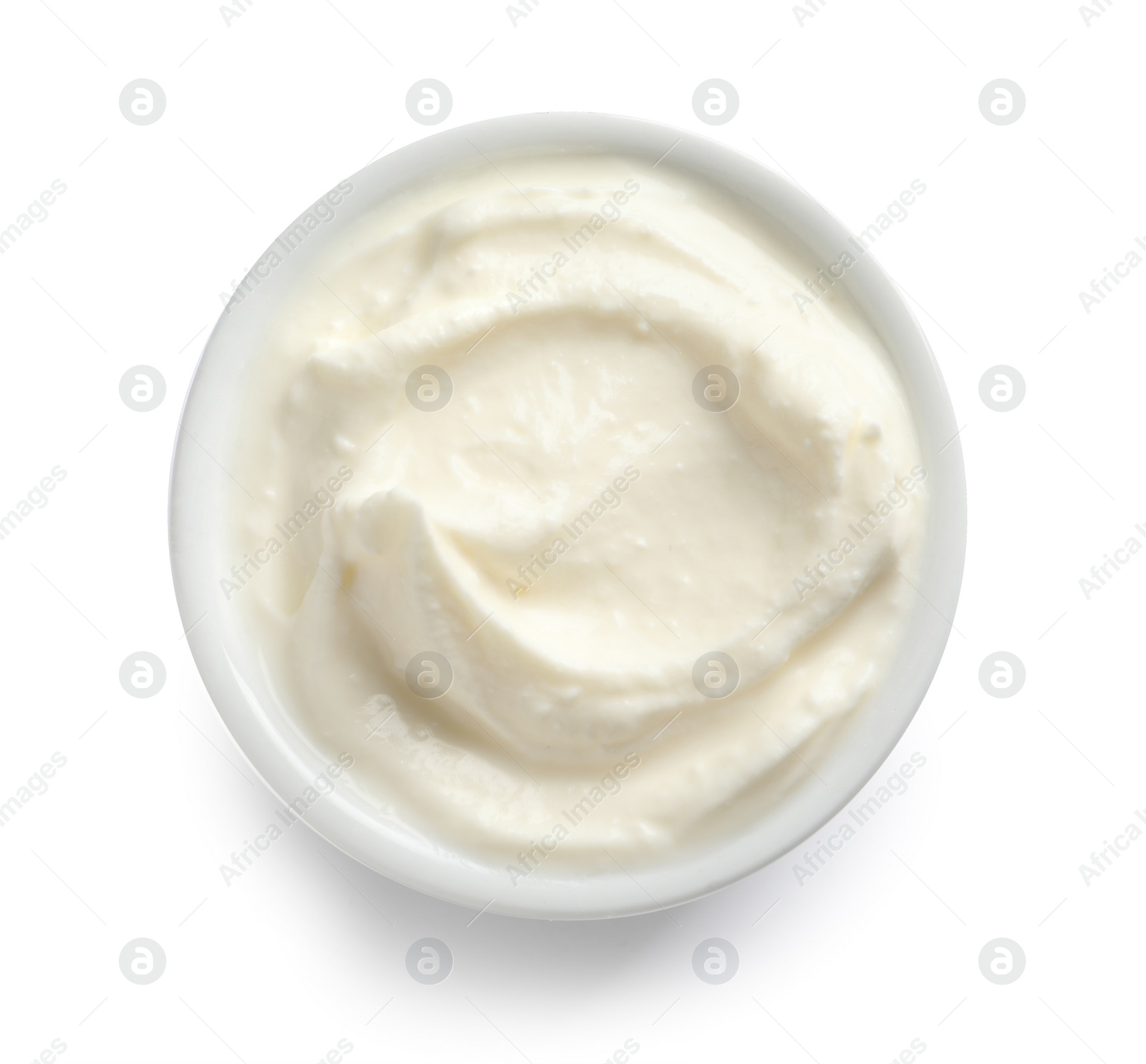 Photo of Bowl of tasty cream cheese on white background, top view