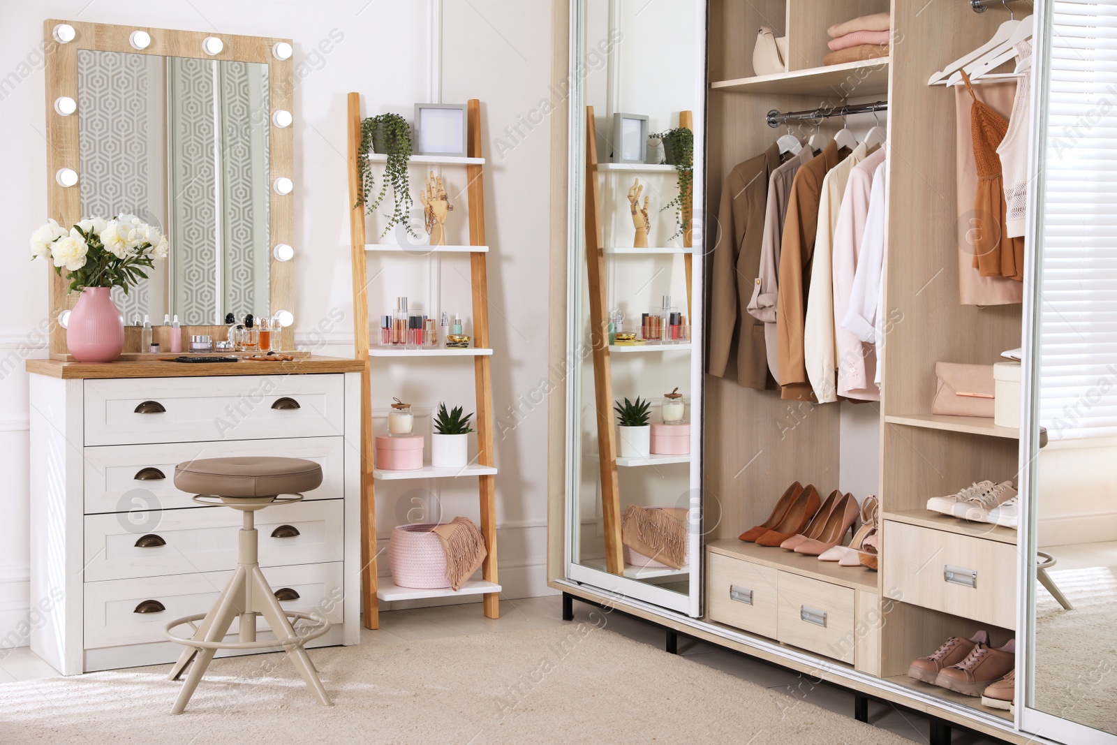 Photo of Elegant room with dressing table and wardrobe. Interior design