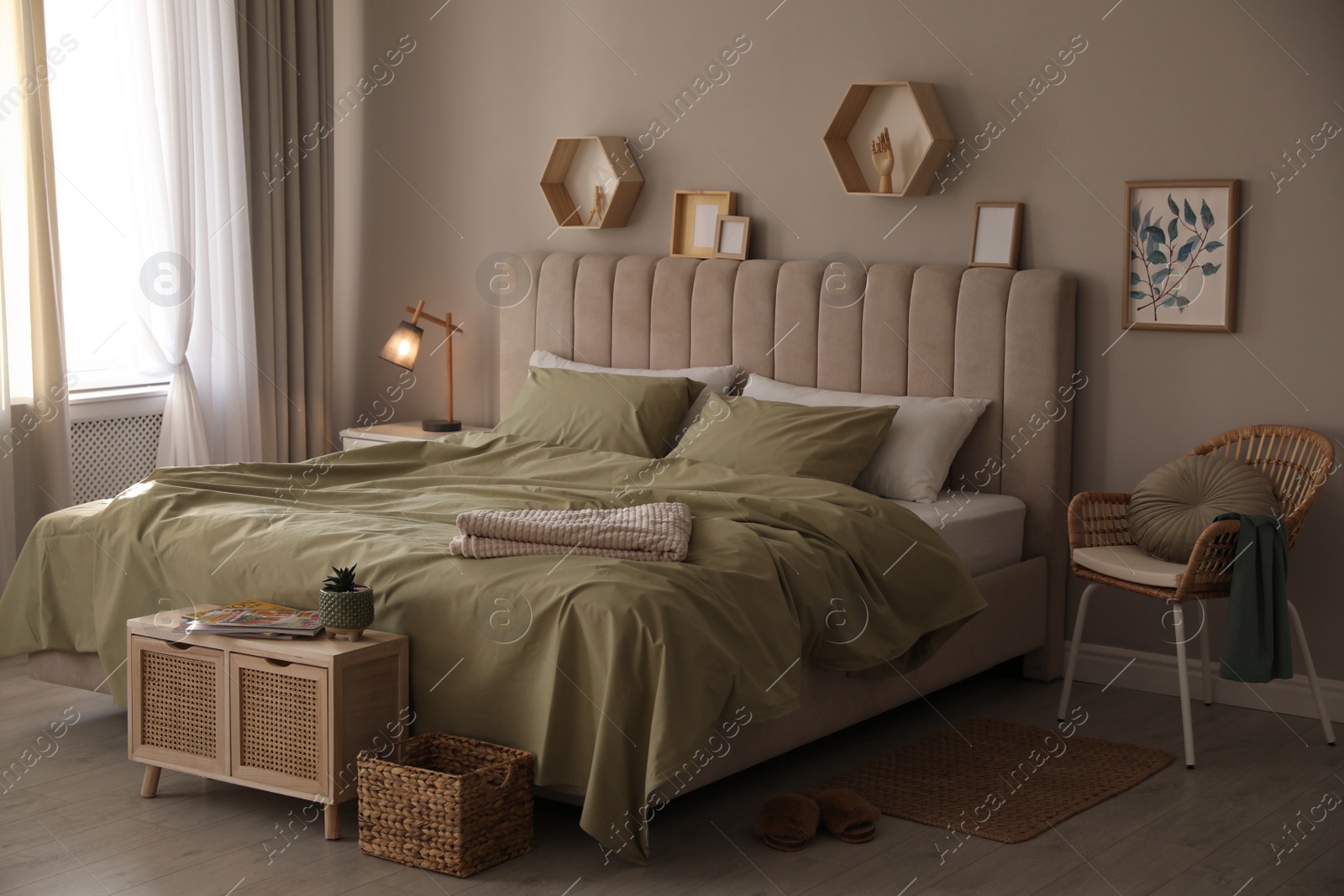 Photo of Large comfortable bed with beautiful linens in room
