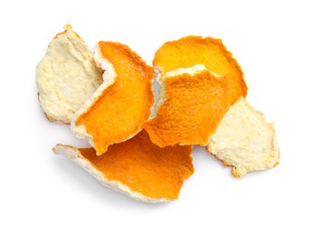 Photo of Pile of dry orange peels on white background, top view