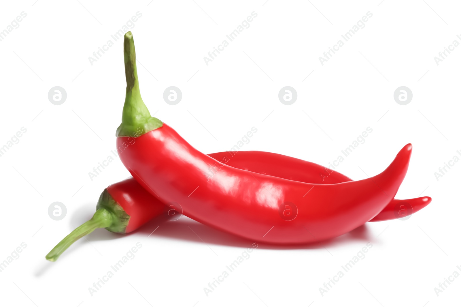 Photo of Red hot chili peppers on white background