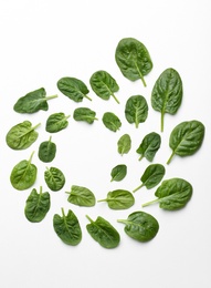 Frame made of spinach leaves on white background, top view. Space for text