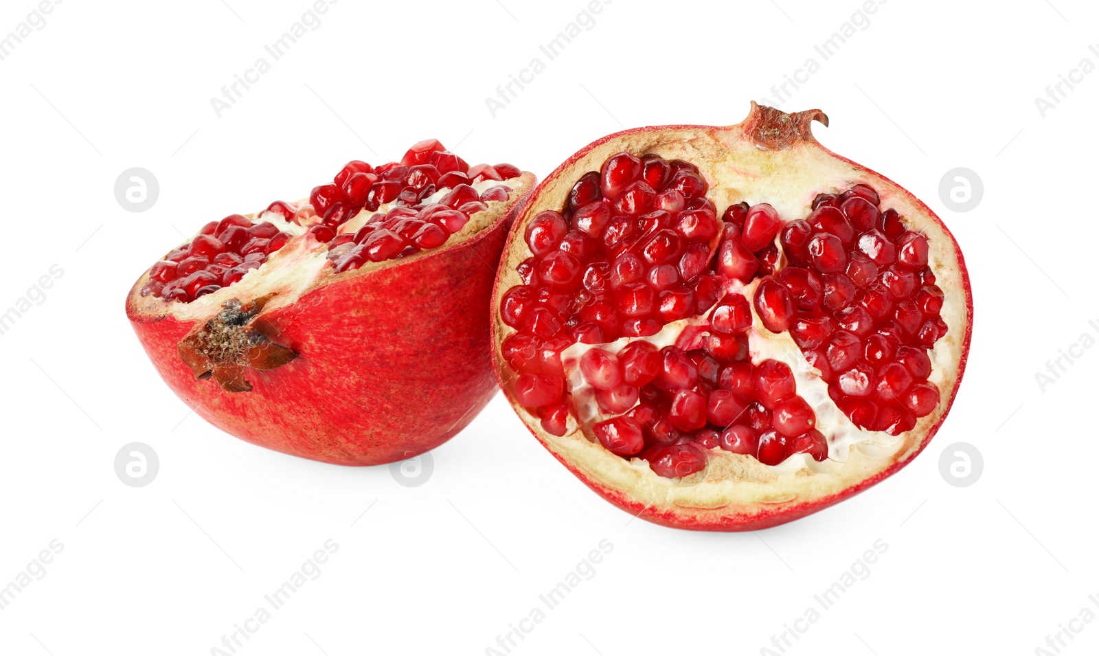 Photo of Halves of fresh pomegranate isolated on white