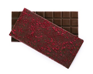 Chocolate bars with freeze dried berries on white background, top view