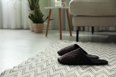 Soft slippers on carpet in living room