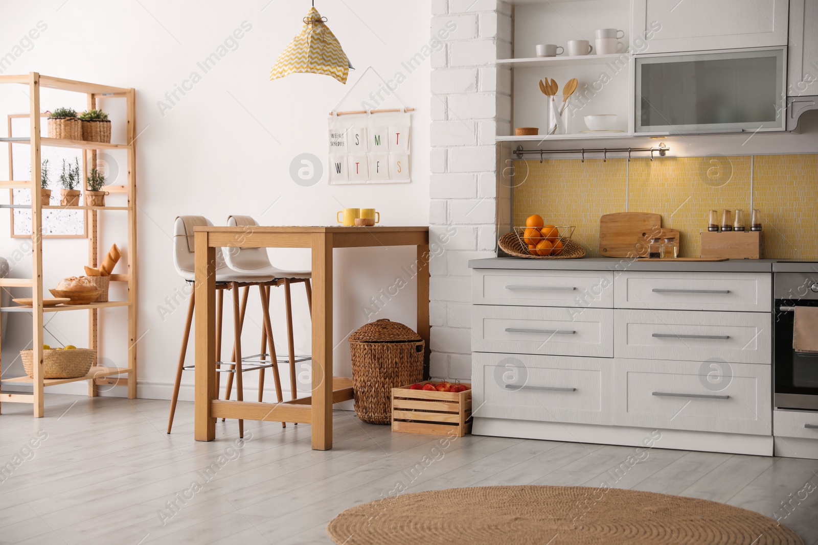 Photo of Modern kitchen interior with stylish wooden table