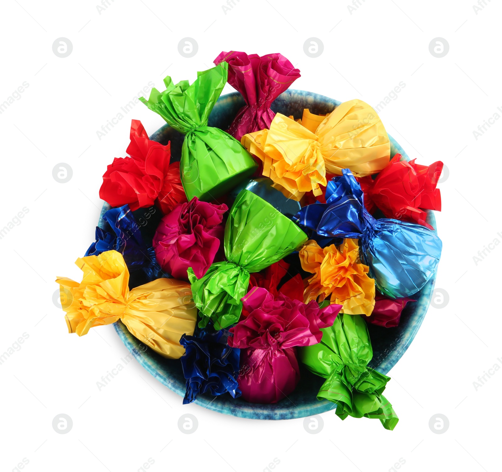 Photo of Bowl with candies in colorful wrappers isolated on white, top view