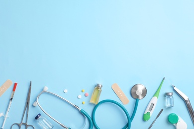 Flat lay composition with medical items and space for text on color background