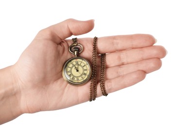 Woman holding pocket clock with chain on white background, closeup