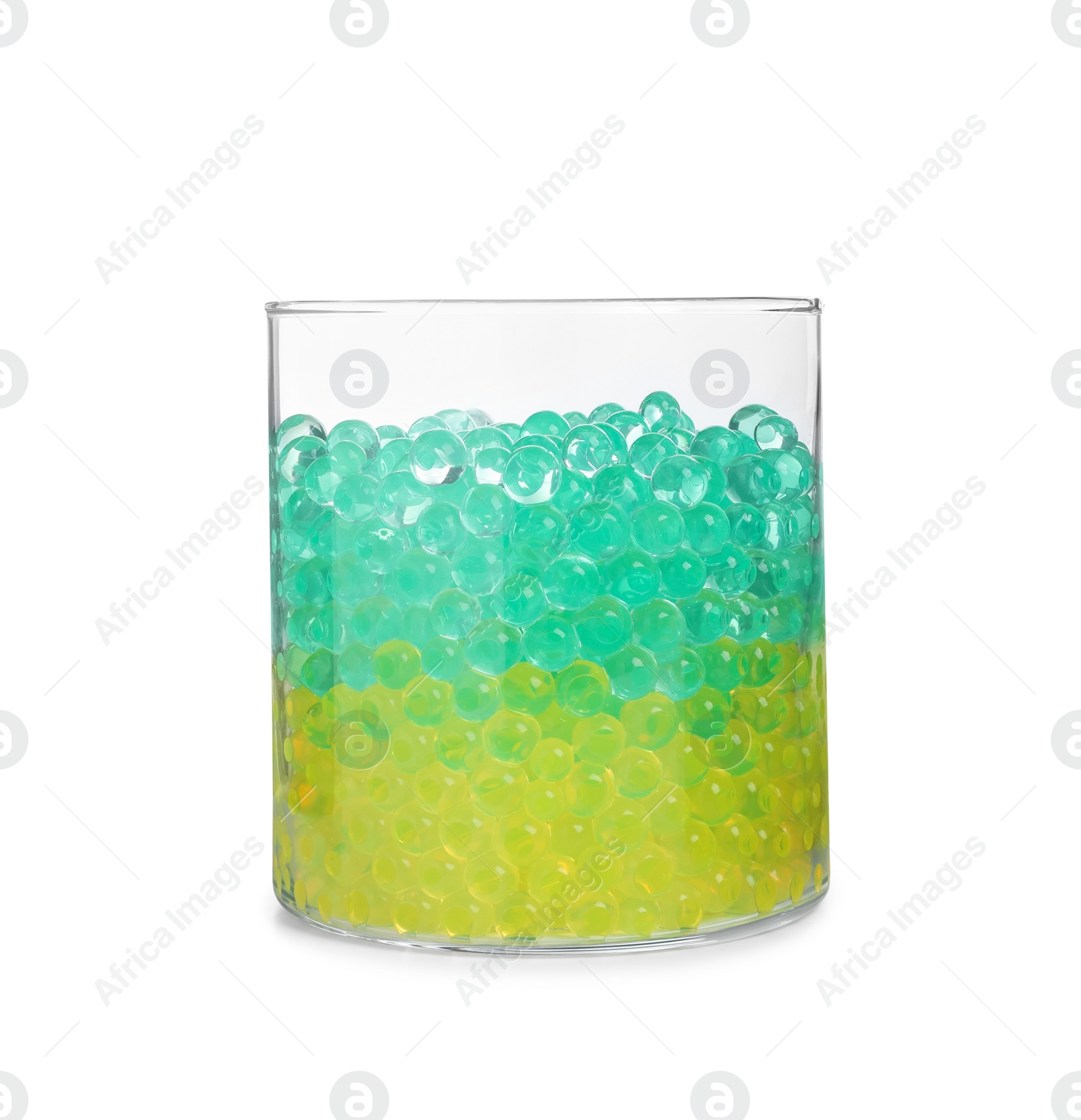 Photo of Different color fillers in glass vase isolated on white. Water beads