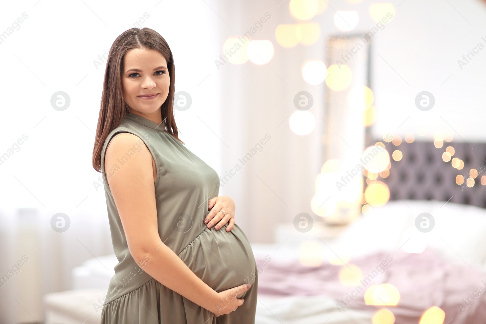 Photo of Beautiful pregnant woman at home