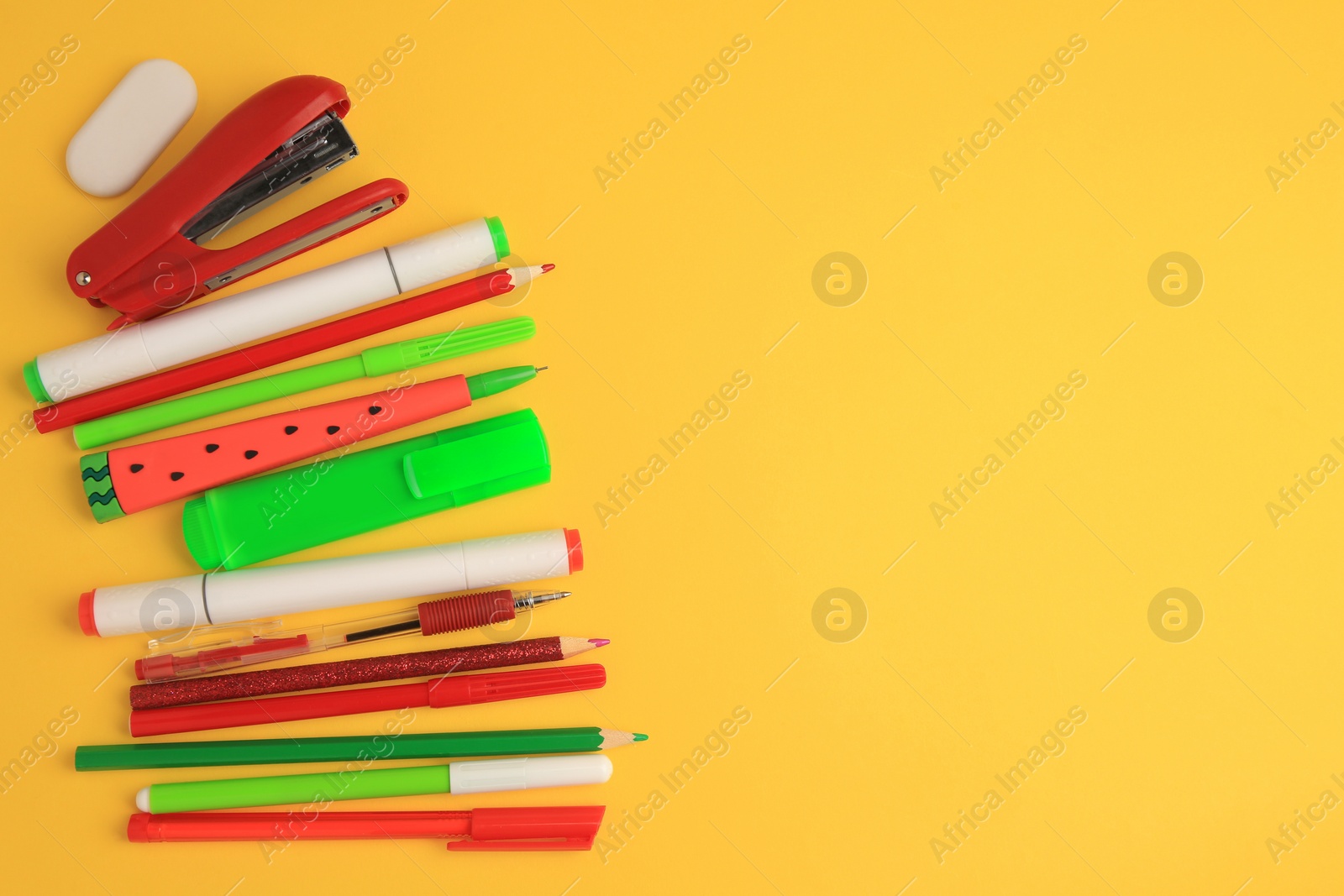 Photo of Flat lay composition with different school stationery on orange background, space for text. Back to school