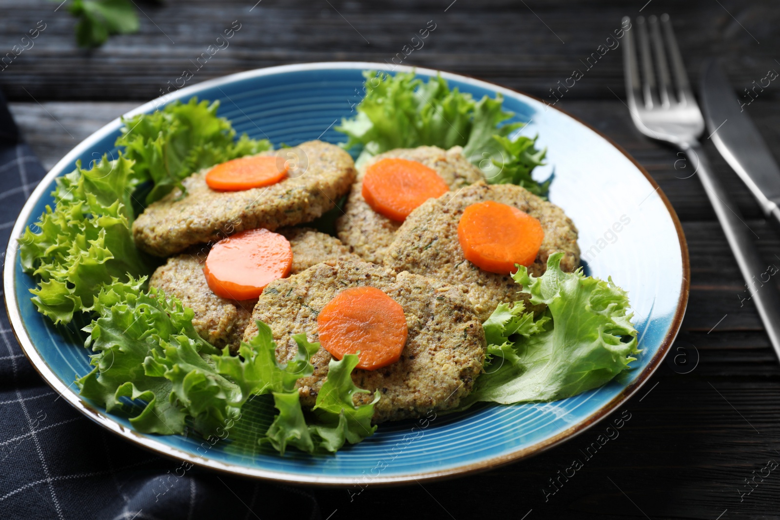 Photo of Plate of traditional Passover (Pesach) gefilte fish on wooden background, closeup