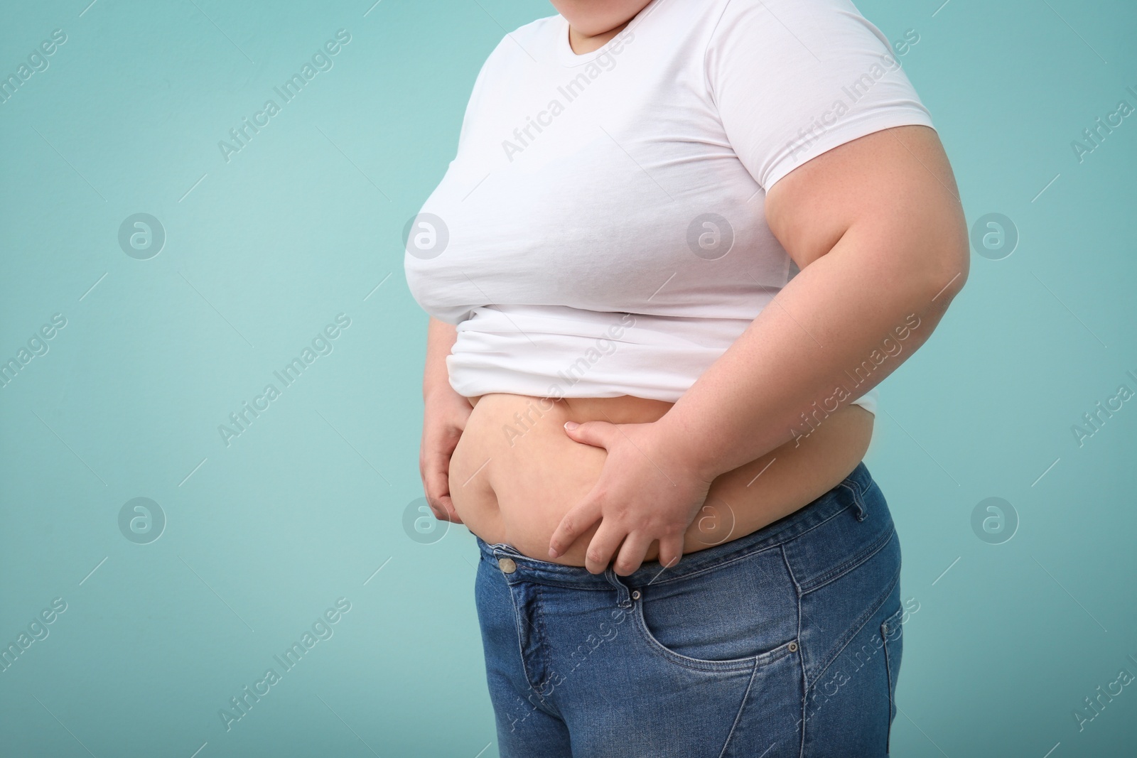 Photo of Overweight woman on color background