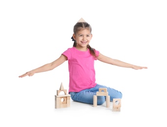 Photo of Cute child playing with wooden blocks on white background