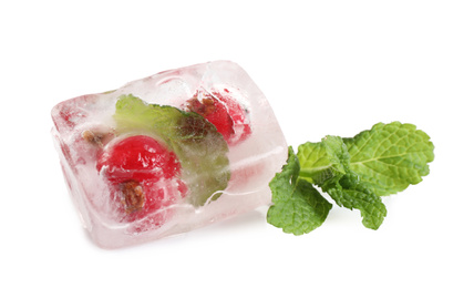 Ice cubes with currant and mint on white background