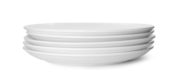 Photo of Stack of clean plates isolated on white