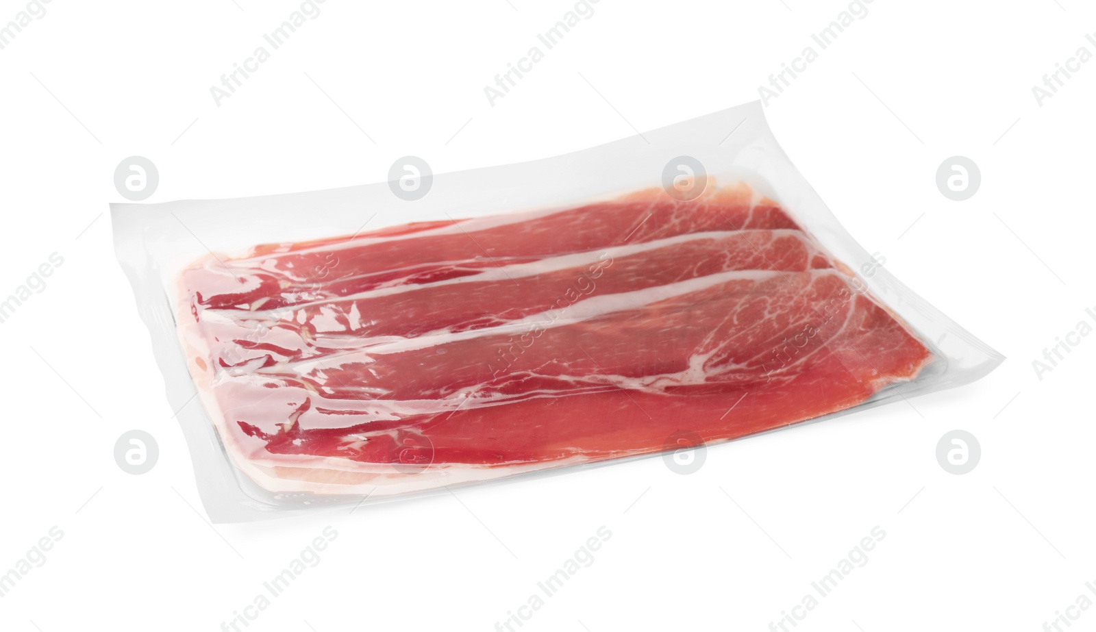 Photo of Pack of delicious sliced jamon isolated on white