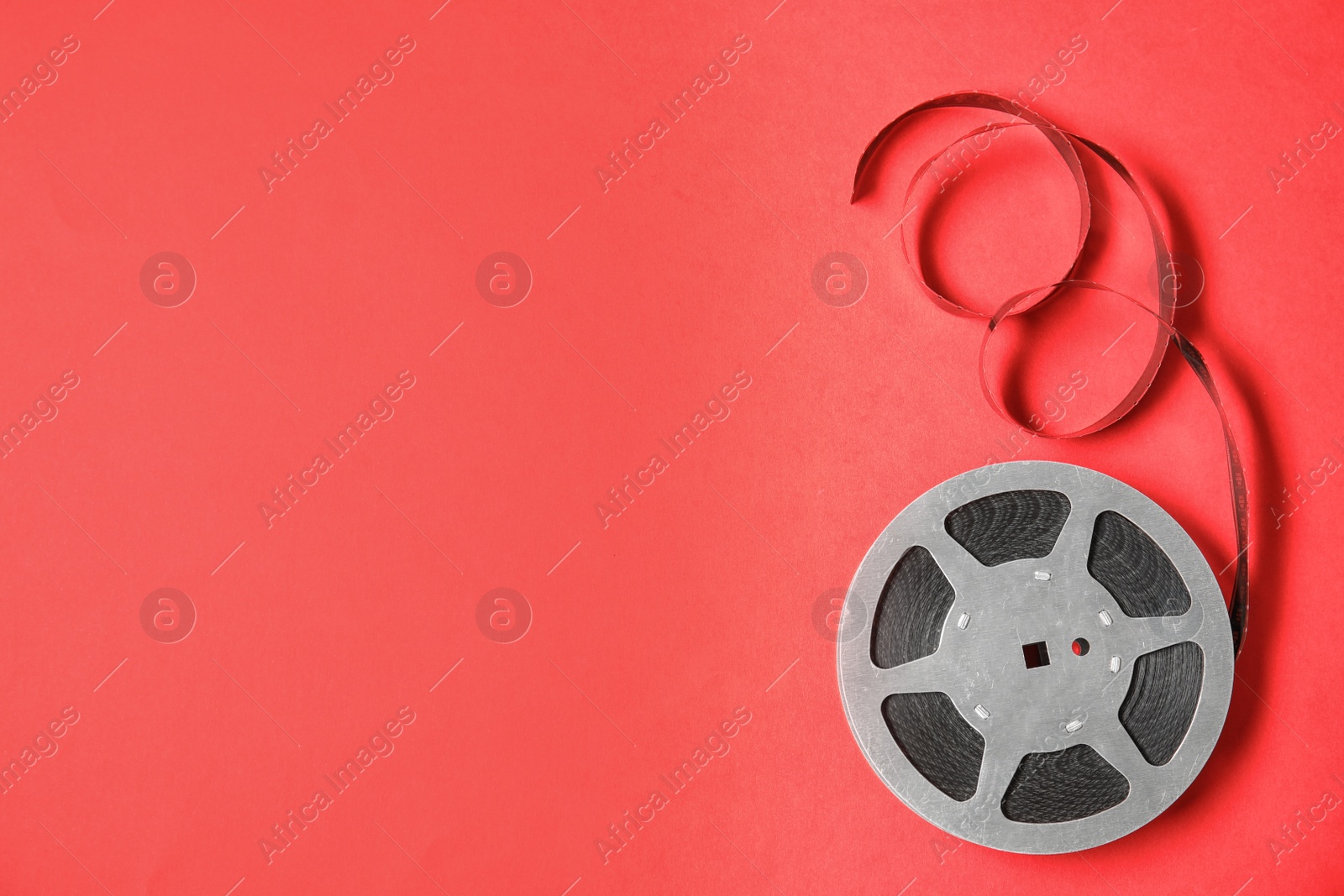 Photo of Movie reel on color background, top view with space for text. Cinema production