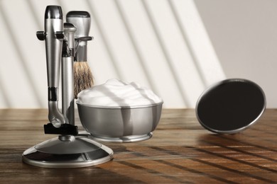 Photo of Set of men's shaving tools on wooden table