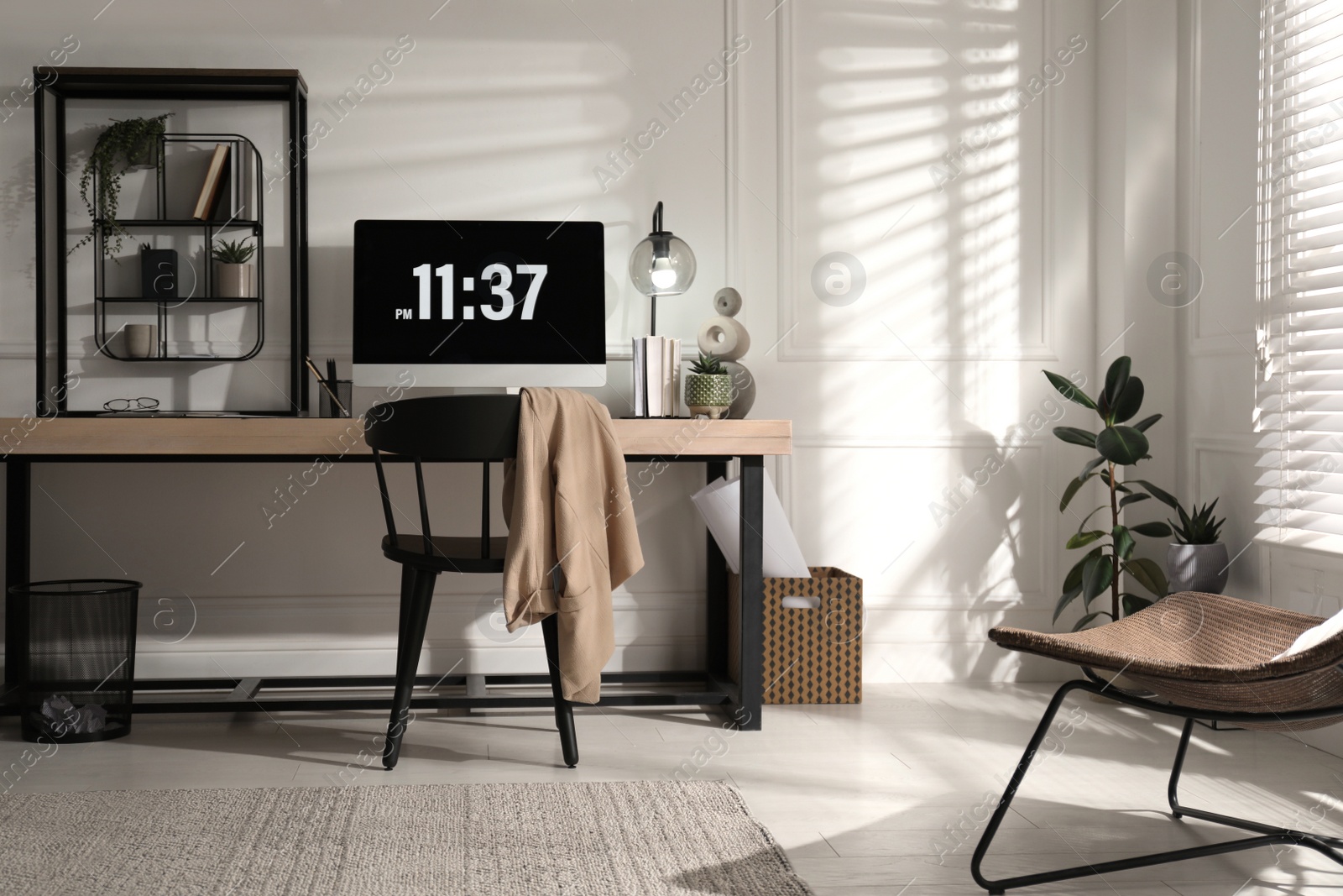 Photo of Room interior with comfortable workplace. Modern computer on wooden desk