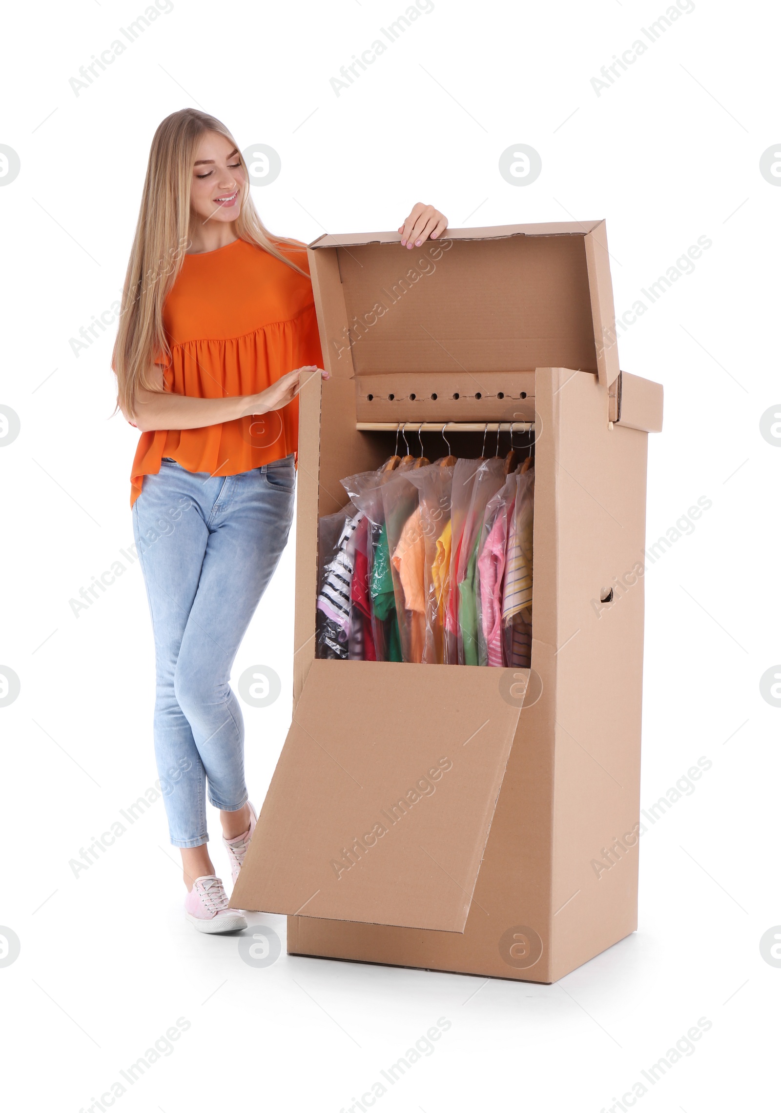 Photo of Young woman near wardrobe box on white background