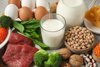 Photo of Different products rich in protein on table, closeup