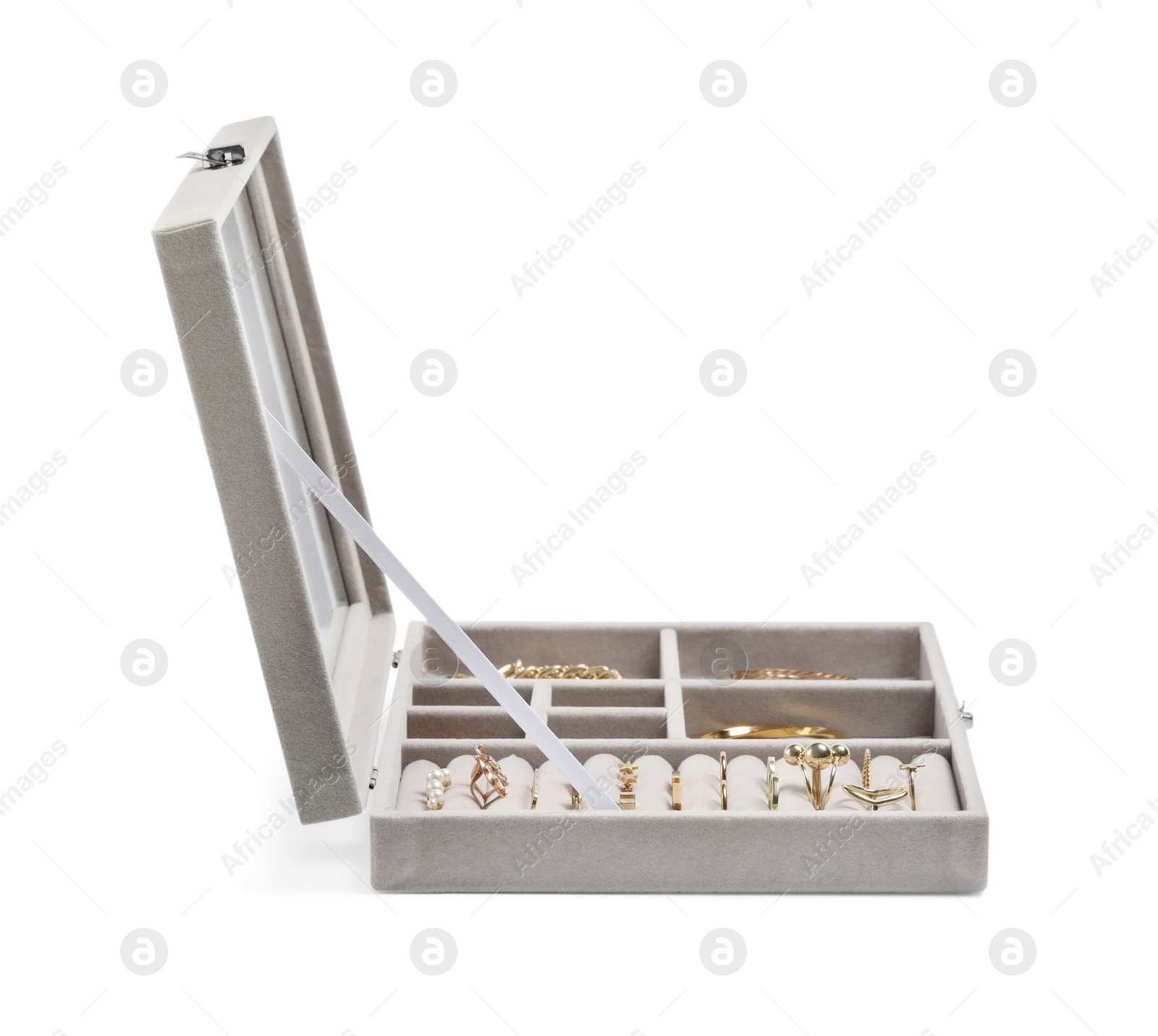 Photo of Jewelry box with many different golden accessories isolated on white