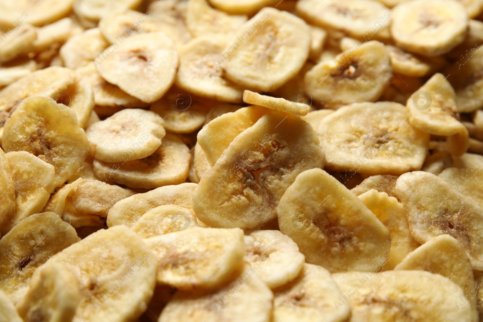 Photo of Sweet banana slices as background. Dried fruit as healthy snack