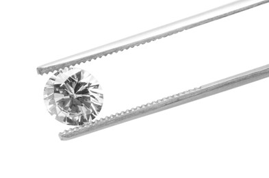 Photo of Tweezers with beautiful shiny diamond isolated on white