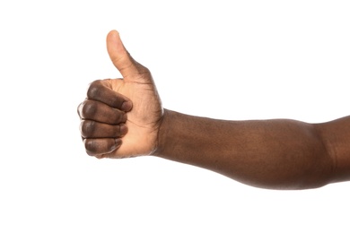 African-American man showing thumb up gesture on white background, closeup