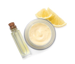Body cream and cosmetic product with lemon on white background, top view