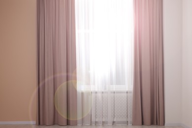 Window with beautiful curtains in room. Interior design