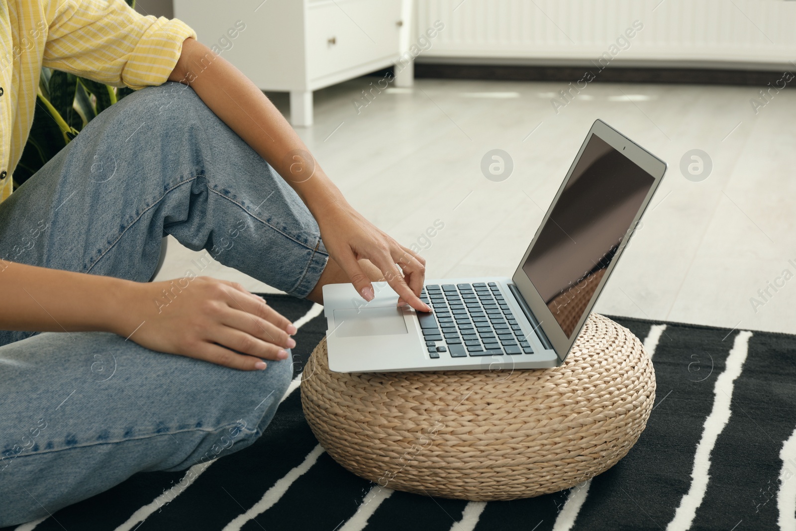 Photo of Woman working with laptop at home, closeup view