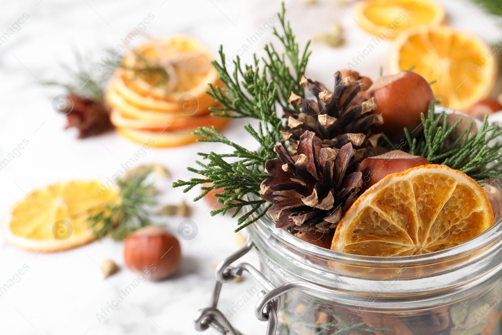 Photo of Aroma potpourri with different spices in jar, closeup view. Space for text