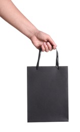 Photo of Woman holding paper shopping bag on white background, closeup