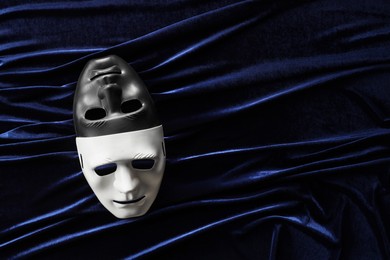 Theater arts. Two masks on blue fabric, top view. Space for text