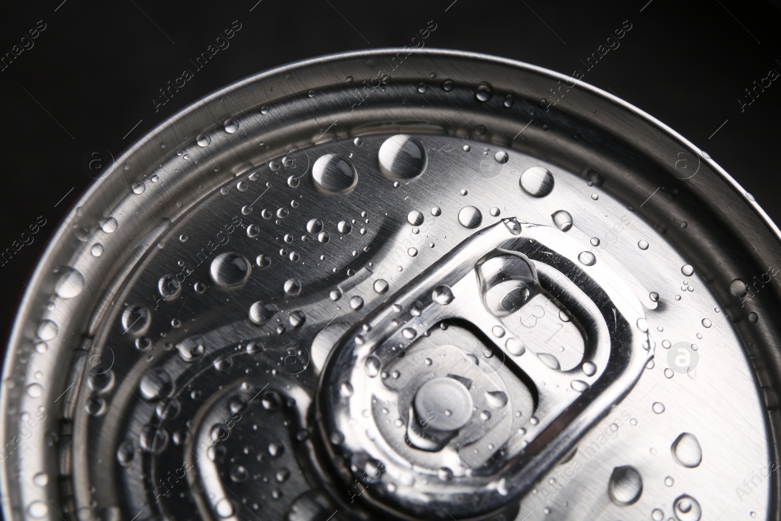 Photo of Energy drink in wet can, closeup. Functional beverage