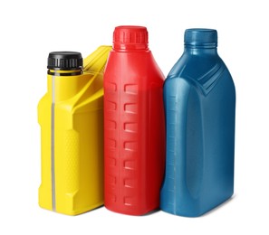 Photo of Plastic bottles with liquids on white background