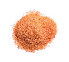 Photo of Heap of orange salt on white background, top view