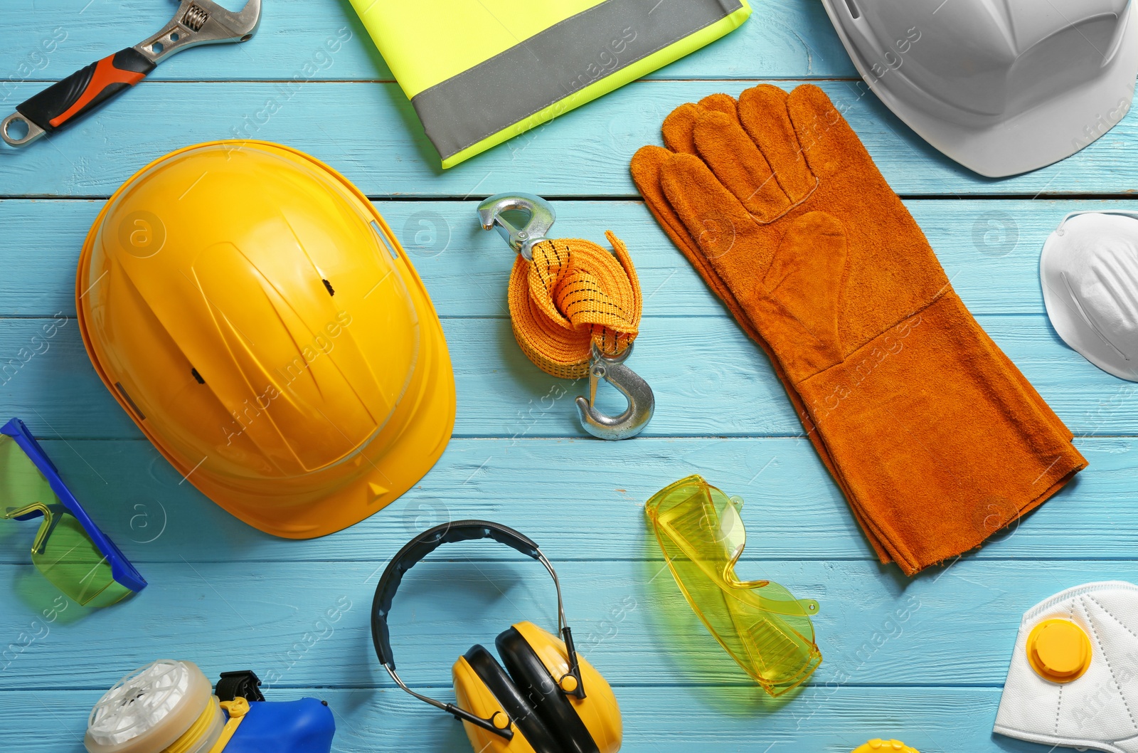 Photo of Flat lay composition with safety equipment on wooden background