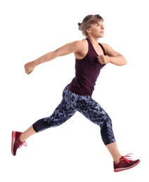 Young woman in sportswear running on white background