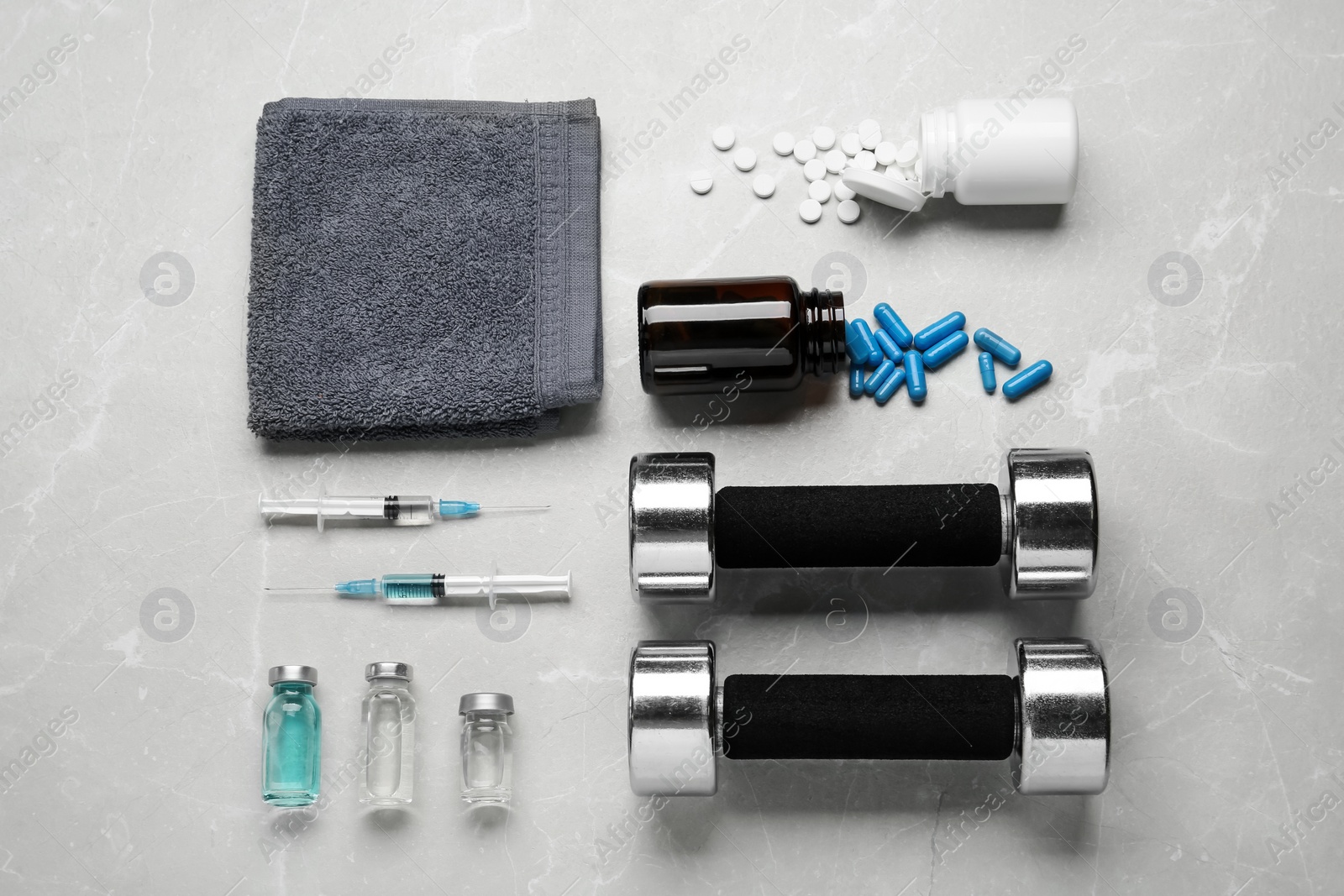 Photo of Different drugs and sports equipment on grey background, flat lay. Doping control