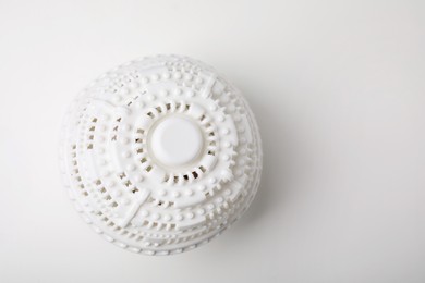 Laundry dryer ball on white table, top view. Space for text